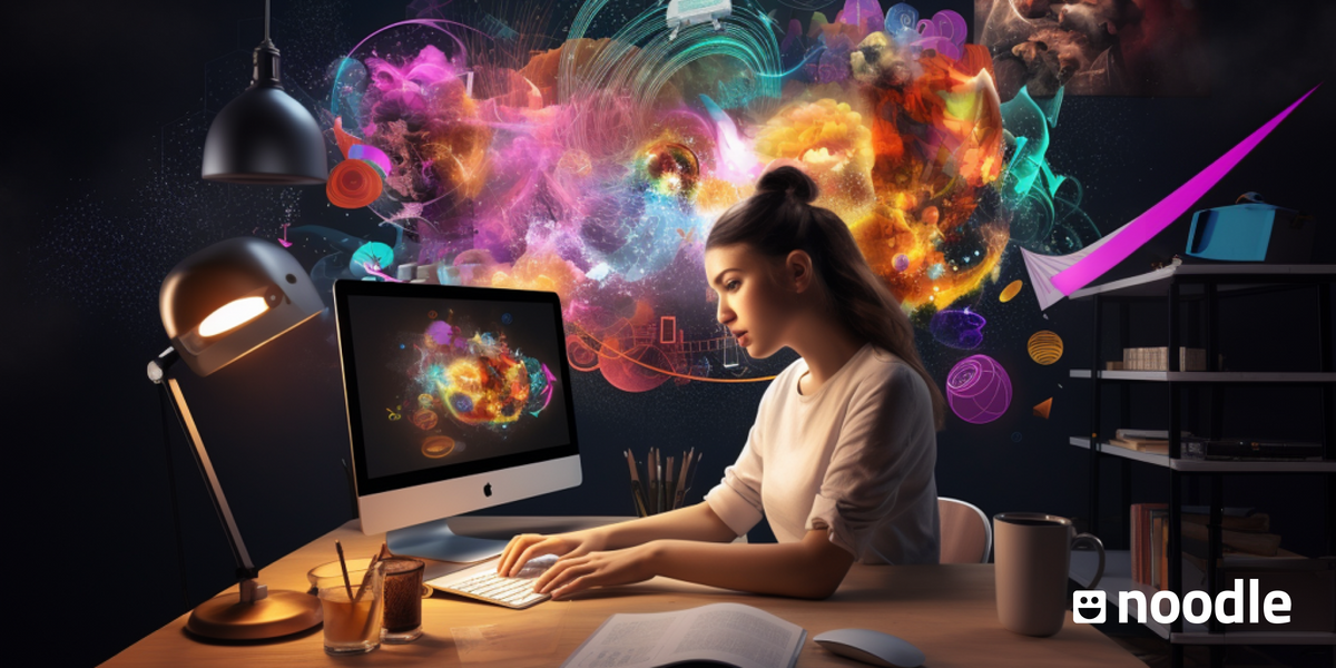 A woman sits in front of her desktop computer, creating a colorful graphic filled with colors and shapes. 